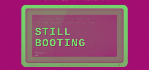 Retro beige CRT monitor displaying a blue boot screen with the headline "Still Booting" above a READY. prompt and block cursor.