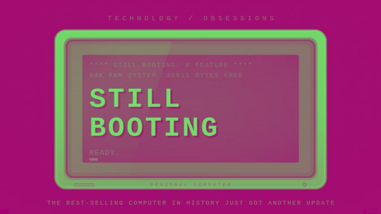 Retro beige CRT monitor displaying a blue boot screen with the headline "Still Booting" above a READY. prompt and block cursor.