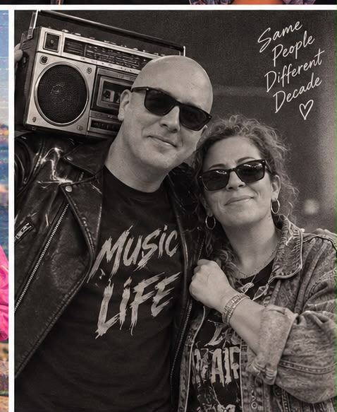 Black-and-white portrait of a couple in 1980s leather and denim with sunglasses and a large cassette stereo.